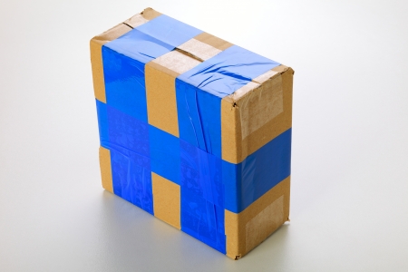 A cardboard box isolated on grey backgroundの写真素材