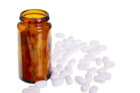 A empty pill jar and white pills isolated on white background, studio shoot, Adobe RGB.の写真素材