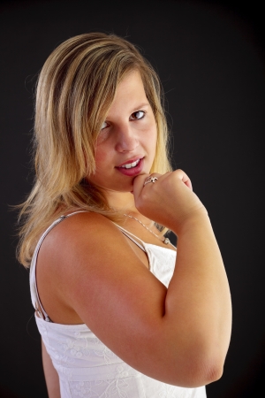 Young blond woman on black backgroundの写真素材