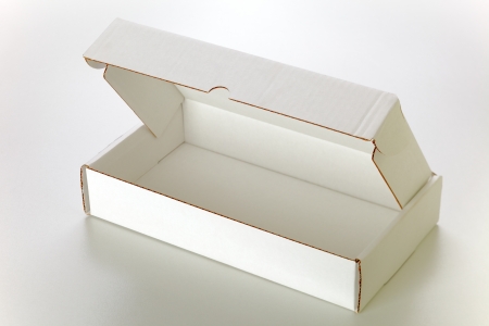 A open white cardboard box isolated on grey backgroundの写真素材