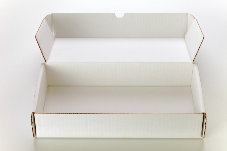 A open white cardboard box isolated on grey backgroundの写真素材