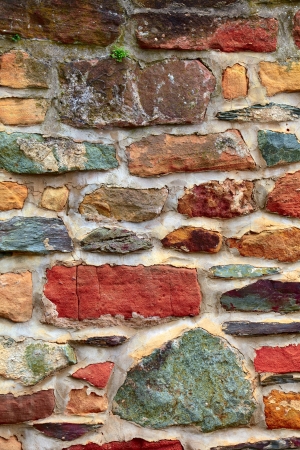 Stone wall with  lichen and moss  in small city Saarburg, Rheinland-Pfalz, Germany, summerの写真素材