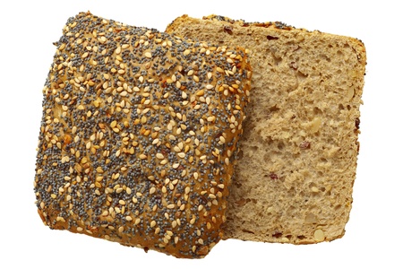 Close up of a whole wheat bread roll with sesame and poppy seeds, isolated on whiteの写真素材
