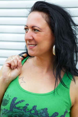 Portrait of a young  woman in background a fountain, outdoor in a small city Dillingen, Saarland / Germanyの写真素材