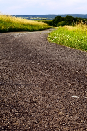 A fields asphalt road in the evening sun, summer, by Honzrath, Saarland/Germany,の写真素材