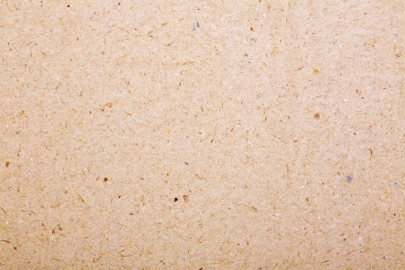 Close up of a beige wrapping cardboard / paper as backgroundの写真素材