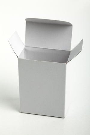 Close up of a small white cardboard box , isolated on white backgroundの写真素材