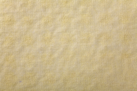 Close up of a yellow cardboard box as a backgroundの写真素材
