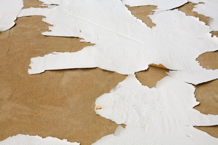 View of a old facade with cracked white paint as a backgroundの写真素材