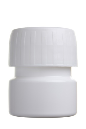 Clode up of a plastic pill container isolated on whiteの写真素材