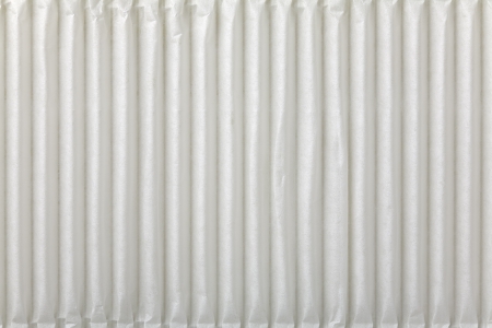 Close up of a white wrapping cardboard/paper as  a backgroundの写真素材