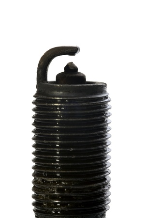 Close up of a old spark plug with carbon deposit isolated on white backgroundの写真素材