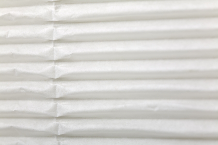 Close up of a white wrapping cardboard/paper as  a backgroundの写真素材