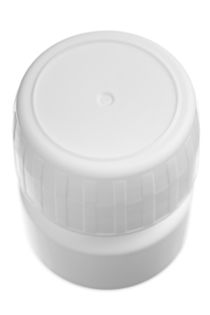 Clode up of a plastic pill container isolated on whiteの写真素材