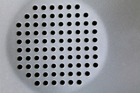Close up of a speaker hole as a interesting backgroundの写真素材