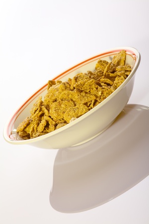 Close up of sweet cornflakes in a porcelain bowlの写真素材