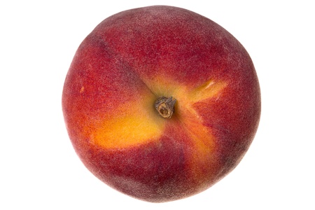 Close up of a peach fruit isolated of whiteの写真素材