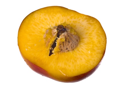Close up of a peach fruit isolated of whiteの写真素材