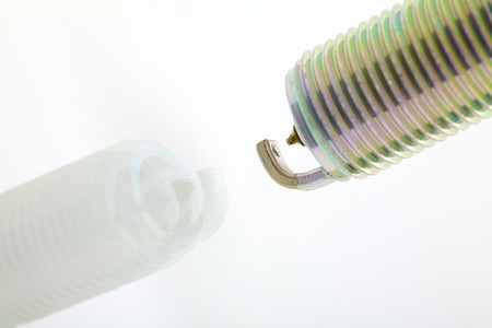 Close up of a spark plug isolated on white backgroundの写真素材