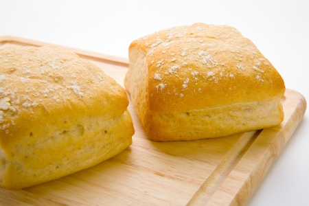 Close up of bread rolls on a boardの写真素材