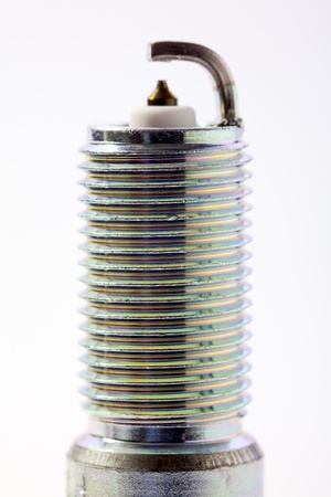 Close up of a spark plug isolated on white backgroundの写真素材