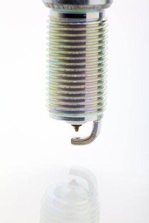 Close up of a spark plug isolated on white backgroundの写真素材