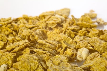 Close up of sweet cornflakes on white backgroundの写真素材
