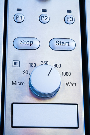 Close up of modern microwave control panel, blue lightの写真素材