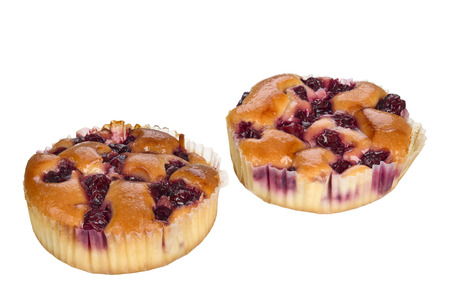 Small cake with cherry fruits isolated on white background.の写真素材