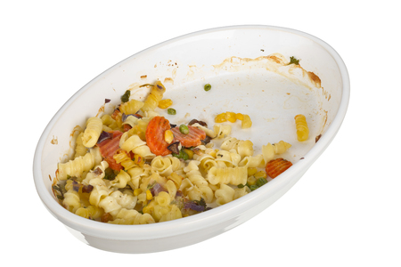 Pasta with cheese gratain in an oval dish isolated on white background.の写真素材