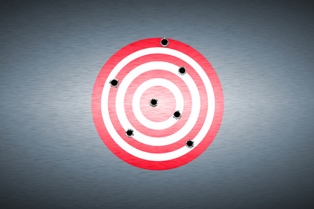 bullet hole on target. metal background. concept design.の写真素材