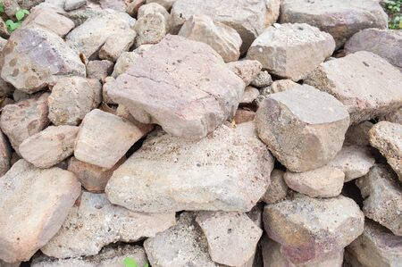 Many stones are stacked together in a pile.の写真素材