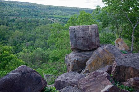 Large rock on the edge of a high cliffの写真素材