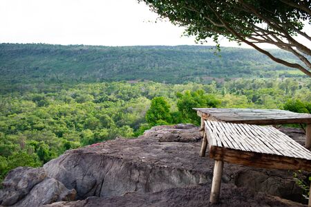 Bamboo litter for sitting on a rock by the cliffの写真素材