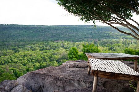 Bamboo litter for sitting on a rock by the cliffの写真素材