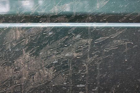 The side of the car body is contaminated with soil and mud