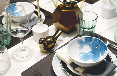 Dinner table setting, condominium style, with plate bowl fork spoonの写真素材
