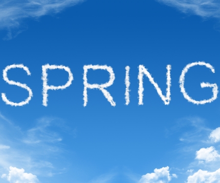 Clouds forming the word spring in the skyの写真素材