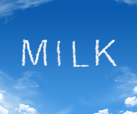 Milk spelled in with clouds in the blue skyの写真素材
