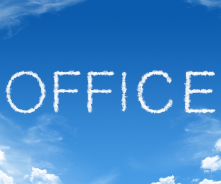 Office spelled in with clouds in the blue skyの写真素材