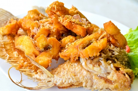 Fried Giant Gourami Fish With Garlic Sauceの写真素材