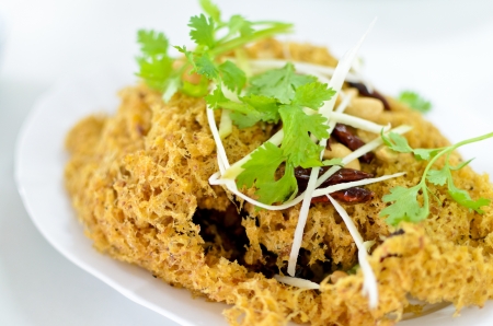 Thai food crispy catfish salad with green mangoの写真素材