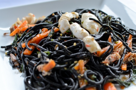 Spicy black spaghetti with prawns and squidの写真素材
