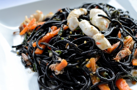 Spicy black spaghetti with prawns and squidの写真素材