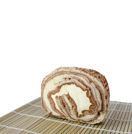 Chocolate cake Roll with fresh cream on bambooの写真素材