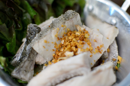 Boiled Sea Bass with spicy seafood sauce - Thai food