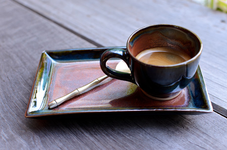 A cup hot espresso coffe on wood tableの写真素材
