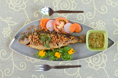 Fried Rainbow Trout with garlicの写真素材