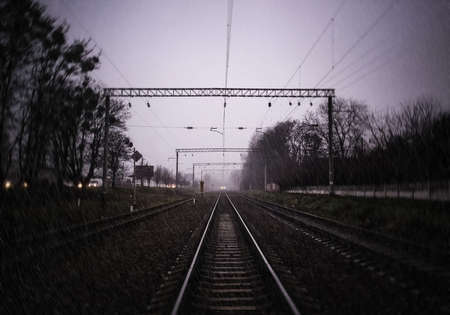 Train and railroad in rainy weatherの写真素材