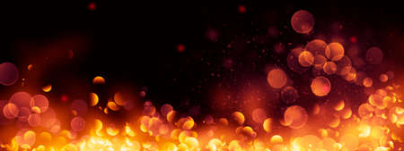 Blurred gold bokeh on black background. Golden glowing background. Abstract defocused backdrop.の写真素材